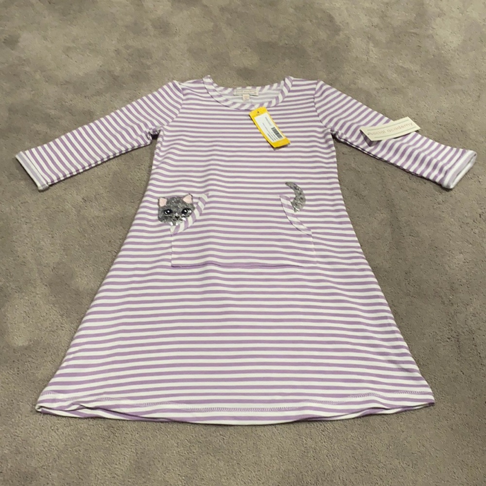 Purple striped dress with pockets and cat design.